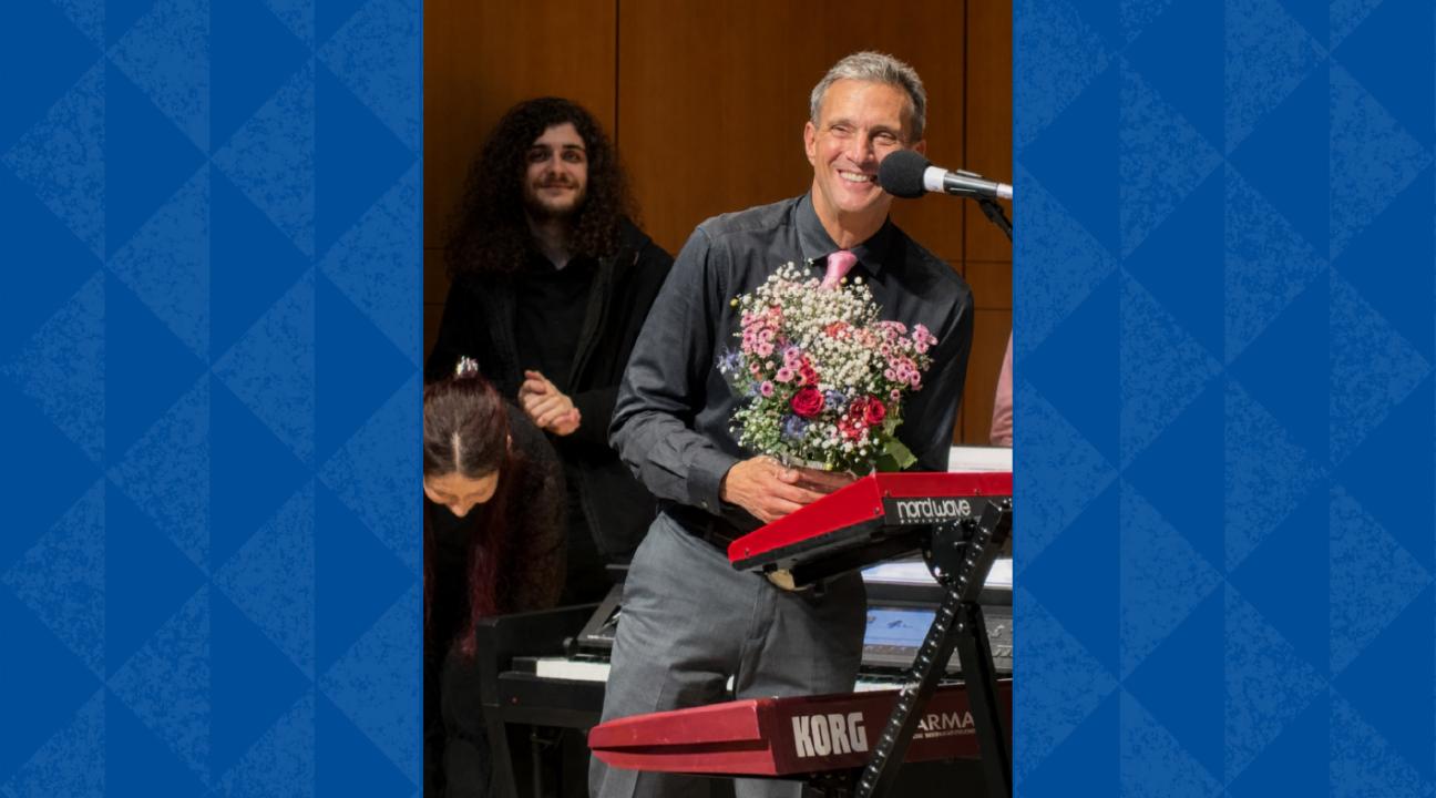 Retiring Sonoma State Professor John Palmer receives a standing ovation and a bouquet of flowers at the conclusion of the May 2 Rock Collegium performance at the Green Music Center.
