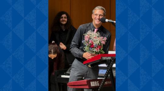Retiring Sonoma State Professor John Palmer receives a standing ovation and a bouquet of flowers at the conclusion of the May 2 Rock Collegium performance at the Green Music Center.