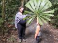 Associate Professor Lisa Patrick Bentley and her son, Allen, showing off a big tropical leaf in Aust