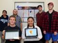 group of students showing data visualization on laptops