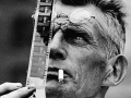 Samuel Beckett examines a piece of film