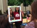 students pose for photo at earth day event on campus
