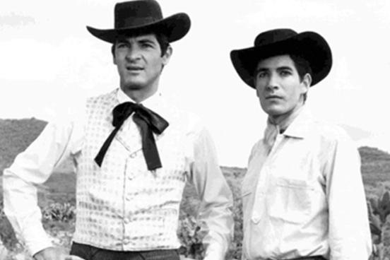 Still from Arturo Ripstein's film "Tiempo De Morir" (1966). Two men in vaquero attire