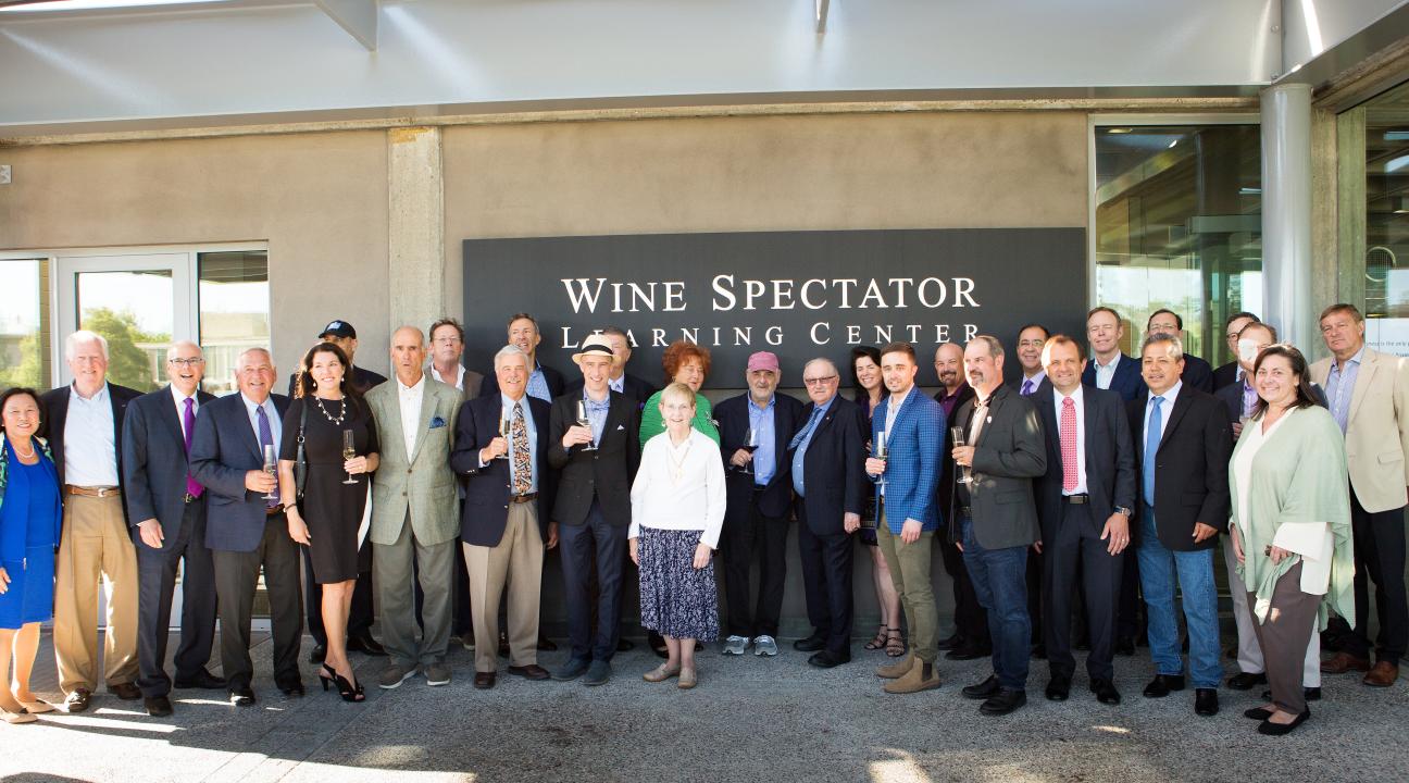 From left, SSU President Judy K. Sakaki, Rep. Mike Thompson, D-St. Helena, WBI Executive Director Ray Johnson and other members of the Wine Business Institute board and key donors pose for a photo outside the new Wine Spectator Learning Center on May 29