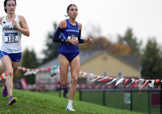 Gianna Bomarito running in cross country event