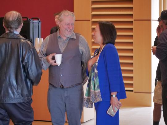 President Sakaki talking to an attendee