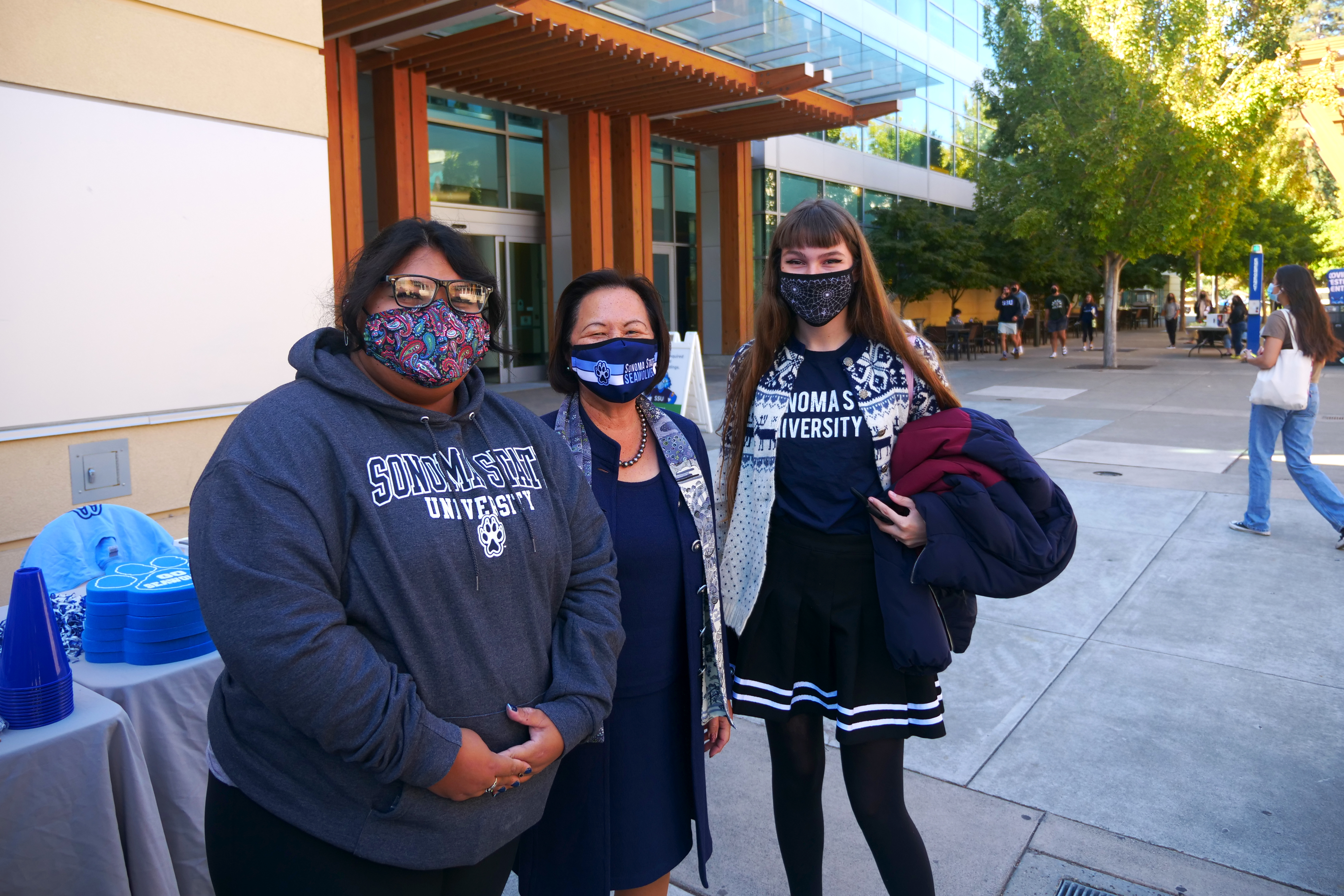 President Judy K. Sakaki poses with two SSU students for Spirit Day