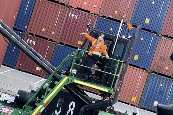 SSU alumna Gina Villeggiante on the docks with shipping containers