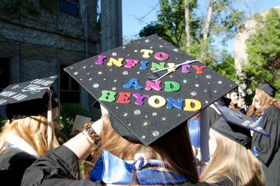 Grad cap reading "To infinity and beyond"