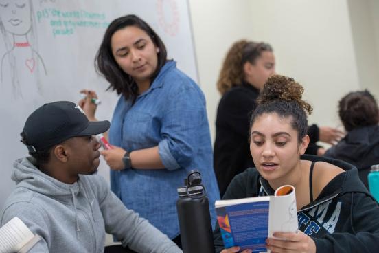 Sonoma State students collaborate on a project in a classroom.