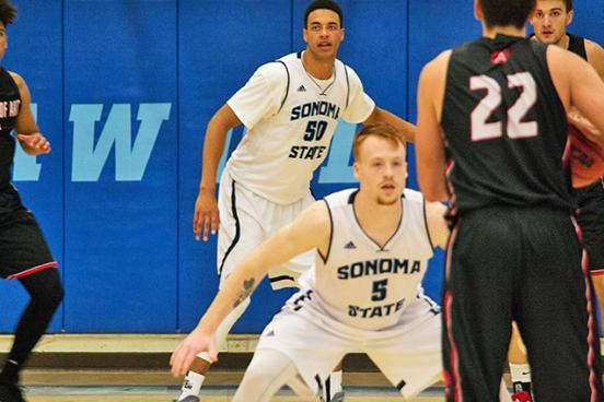 Seawolves playing defense in basketball game