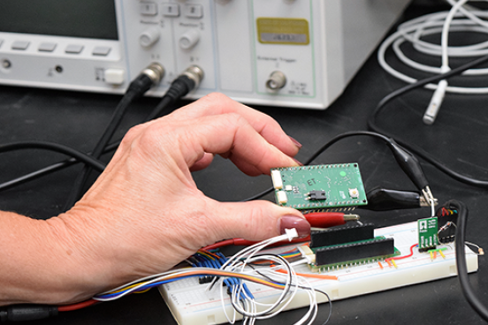hand holding microchip