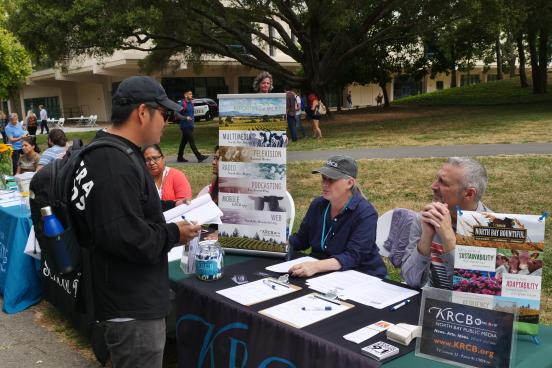 Student learning about new opportunities at tabling event//  Photo by Francisco Carbajal