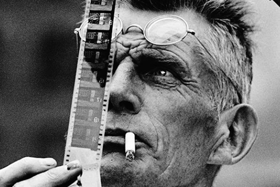 Samuel Beckett examines a piece of film