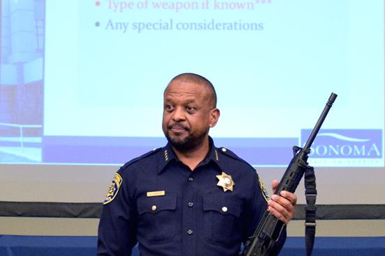 police chief shows automatic weapon