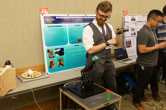 Student shows his project at Sonoma State Science Symposium 