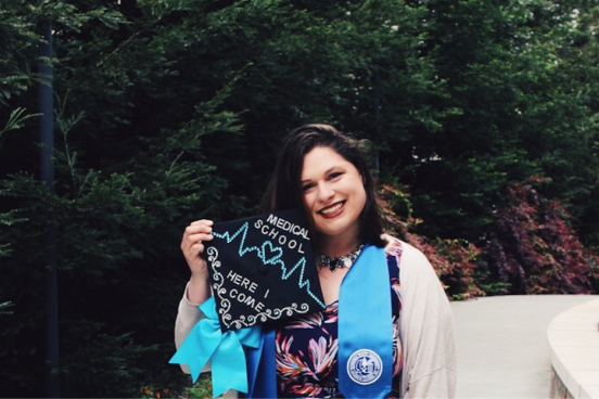 Emma Towslee showing off her graduation cap
