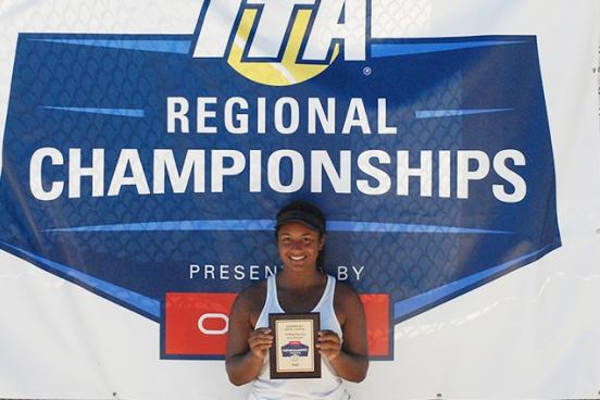 tennis player holding plaque