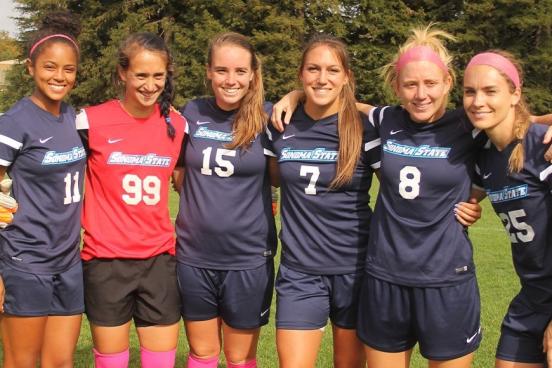 women's soccer team posing for photo