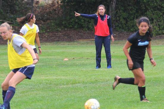 Seventh-year head coach Emiria Salzmann Dunn instructs players during Tuesday's training session.