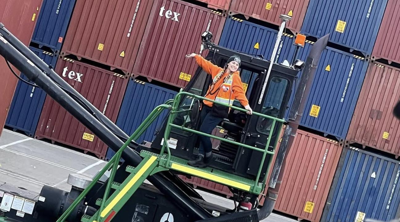 SSU alumna Gina Villeggiante on the docks with shipping containers