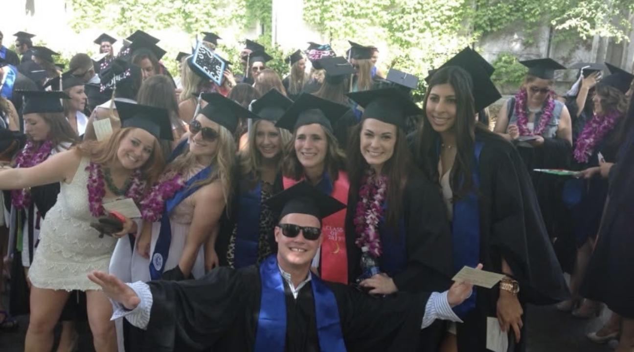 Gina Villeggiante (second from right) flanked by classmates at her 2013 graduation from Sonoma State