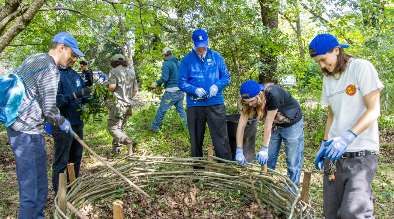 SSU President Michael Spagna and volunteers consider a newly constructed insectary in Native Plant and Butterfly Gardens during Seawolves Dig In Earth Week observance