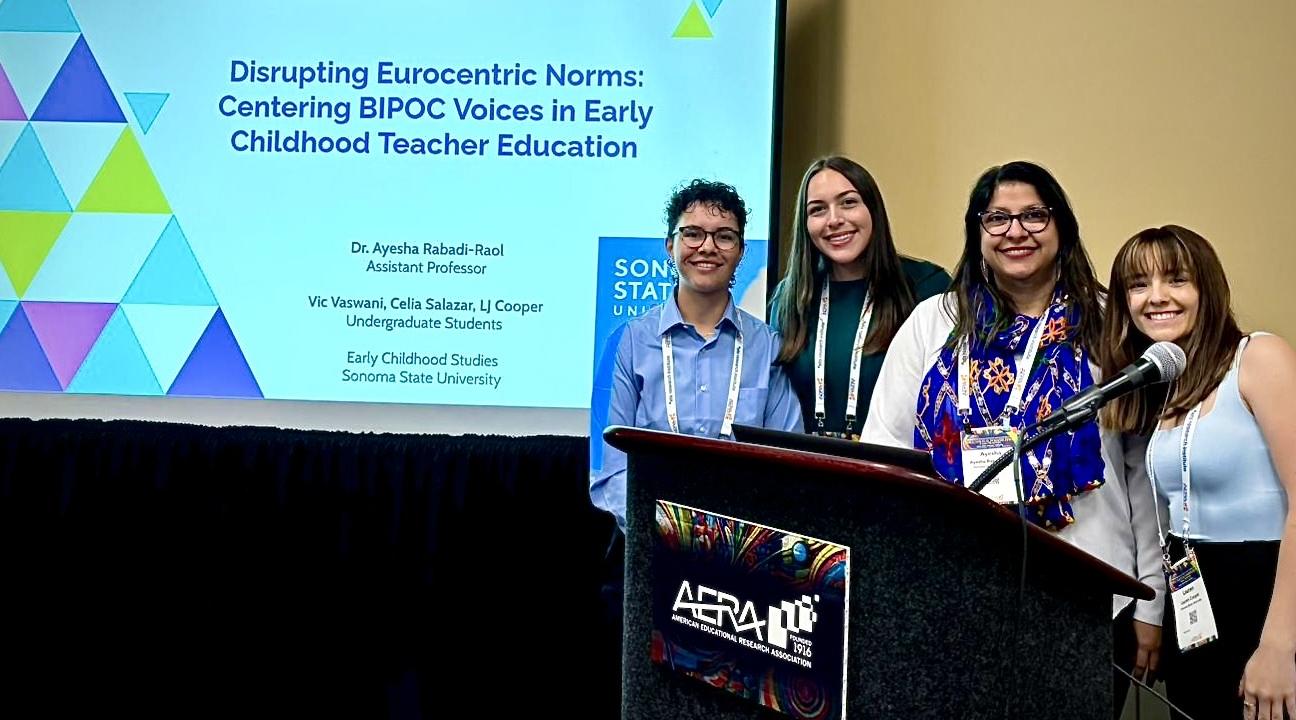 Students and teacher at conference