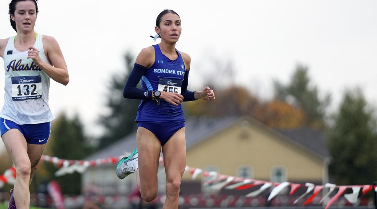 Gianna Bomarito running in cross country event