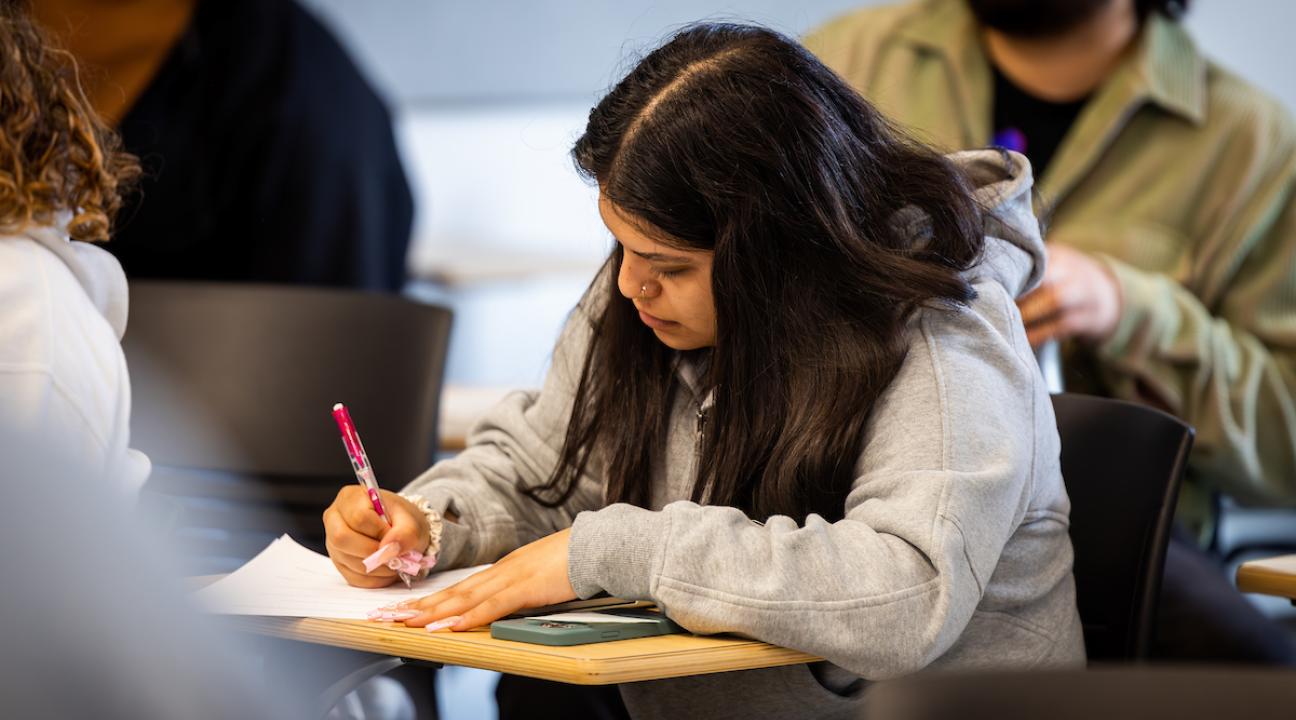 Student taking notes