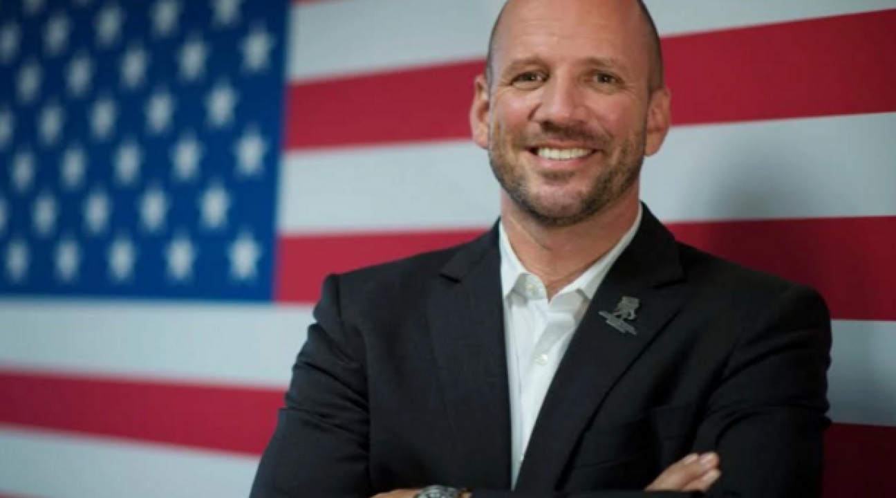 dan nevins in front of american flag
