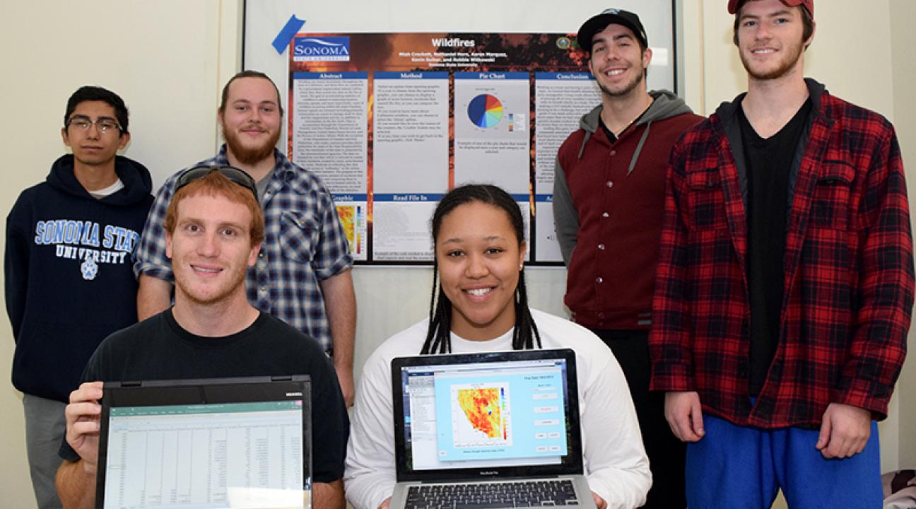 group of students showing data visualization on laptops