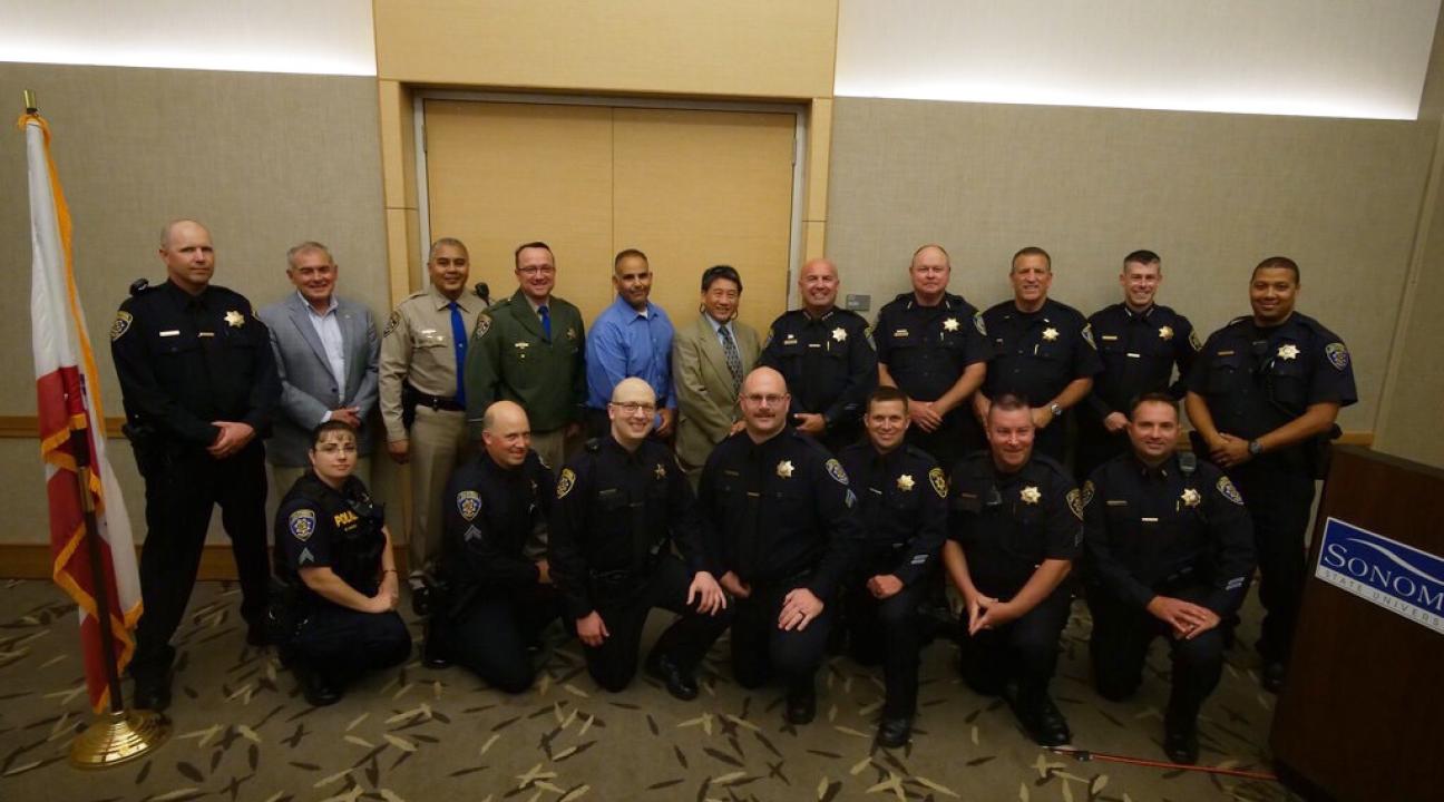 Dougherty with surrounding city officers 