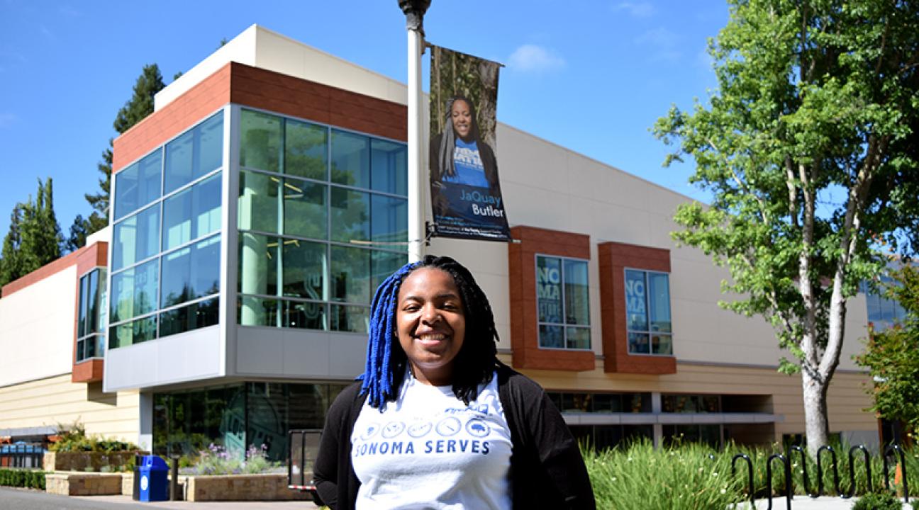 JaQuay Butler under her faces of ssu sign