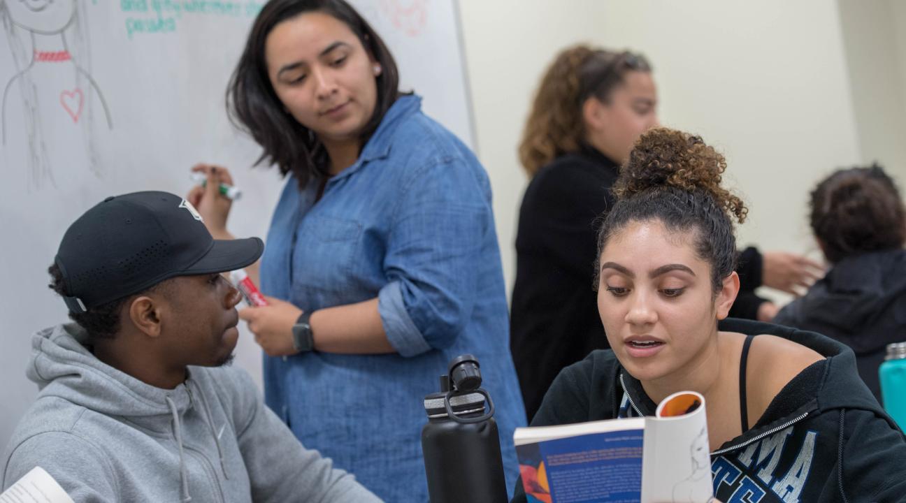 Sonoma State students collaborate on a project in a classroom.