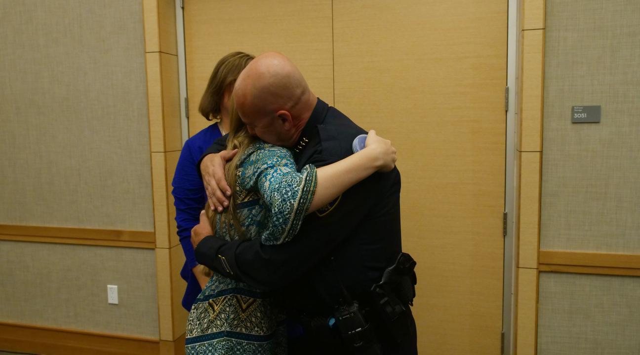 Chief Dougherty's hugging his family // Photo by Francisco Carbajal  