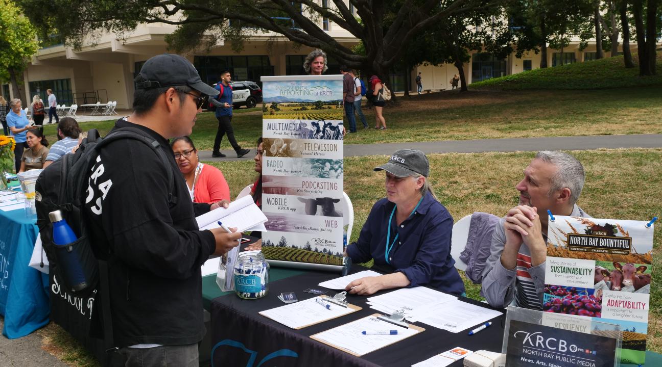 Student learning about new opportunities at tabling event//  Photo by Francisco Carbajal