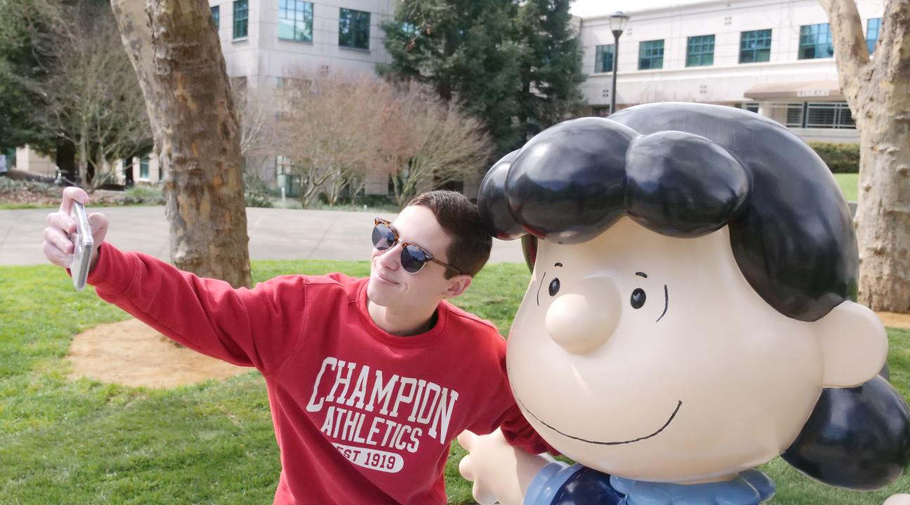 Student Conner Fulps taking selfie with Lucy // Photo by Francisco Carbajal