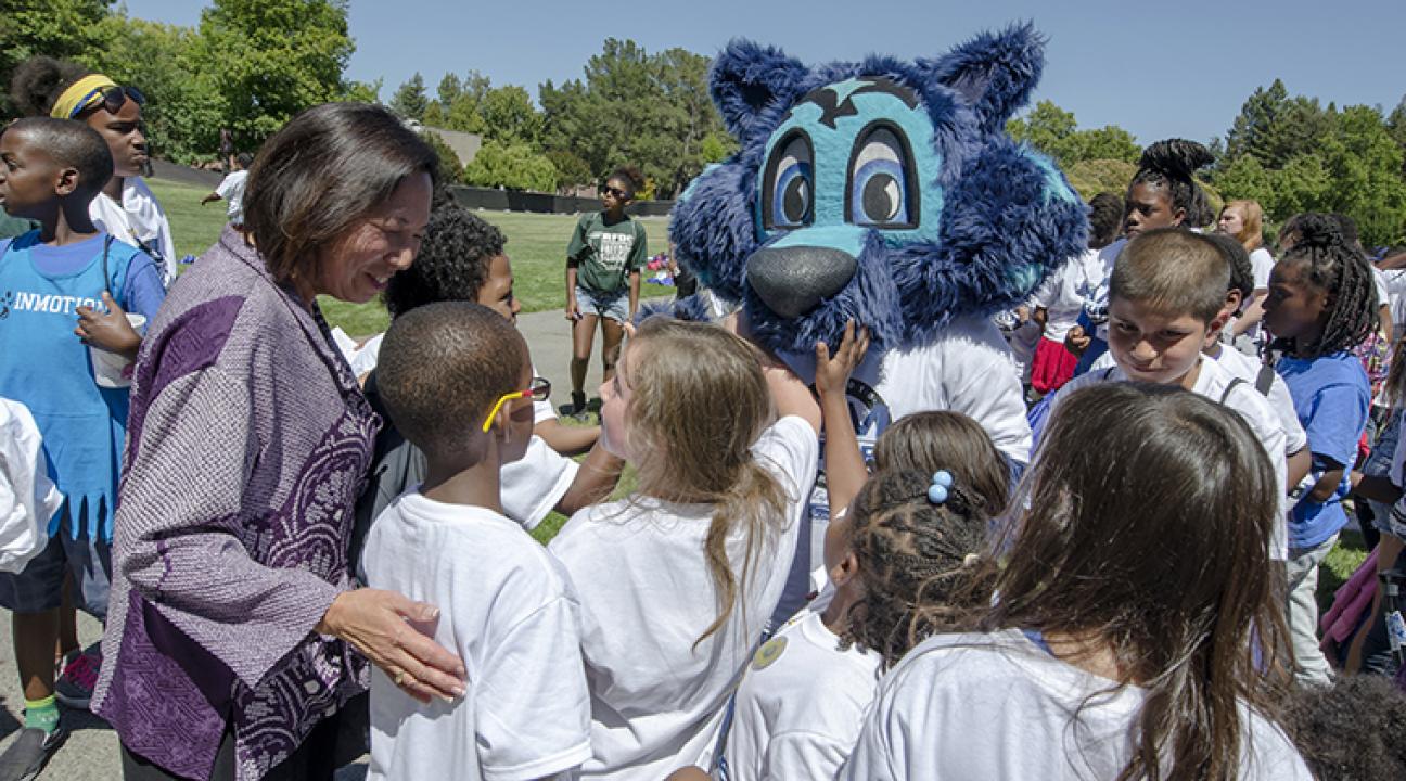 President Judy Sakaki meets with Lobo the Seawolf and students from RFDC