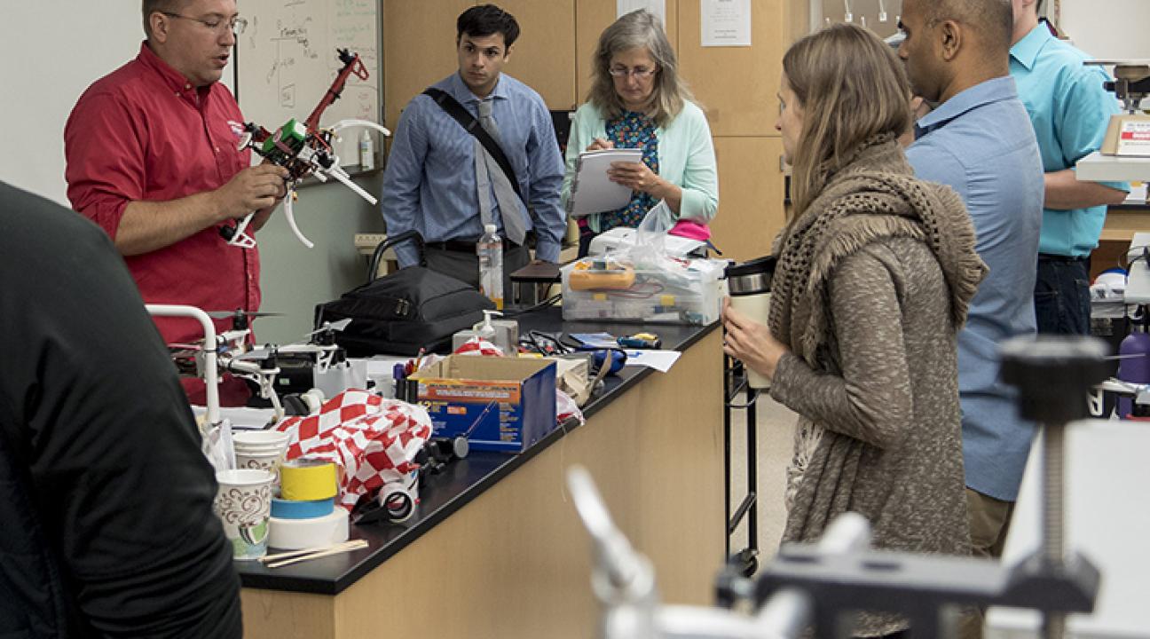 teachers exploring drones in a classroom