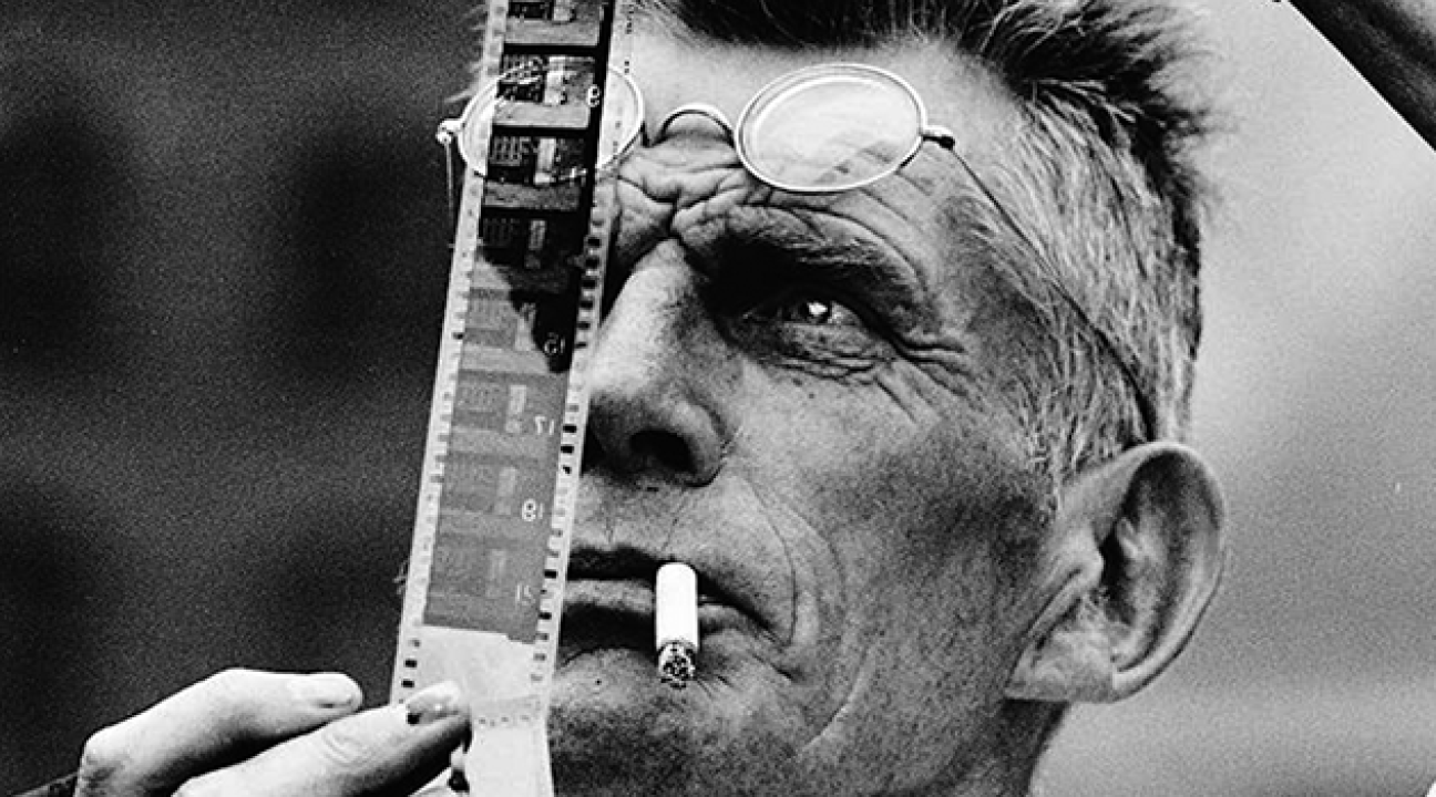 Samuel Beckett examines a piece of film