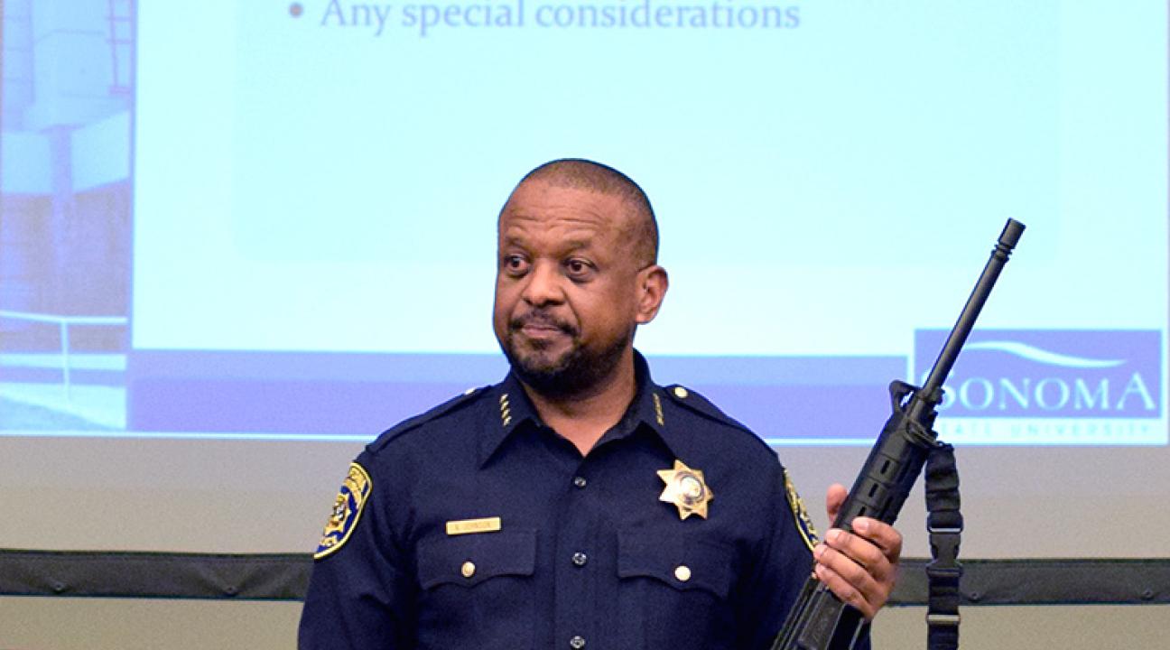 police chief shows automatic weapon