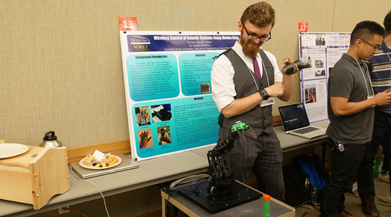 Student shows his project at Sonoma State Science Symposium 