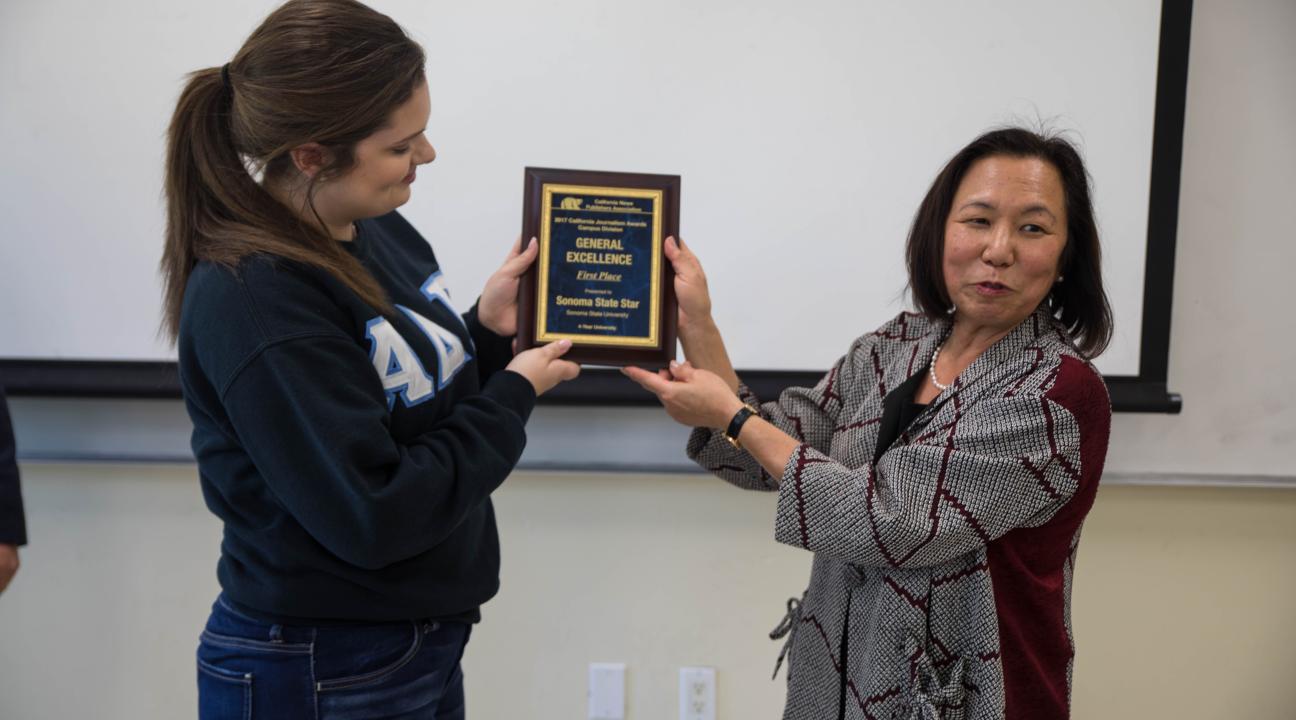 President Sakaki presenting the award to Shannon Brown, the editor-in-chief of the STAR // Photo by Alyssa Archerda 