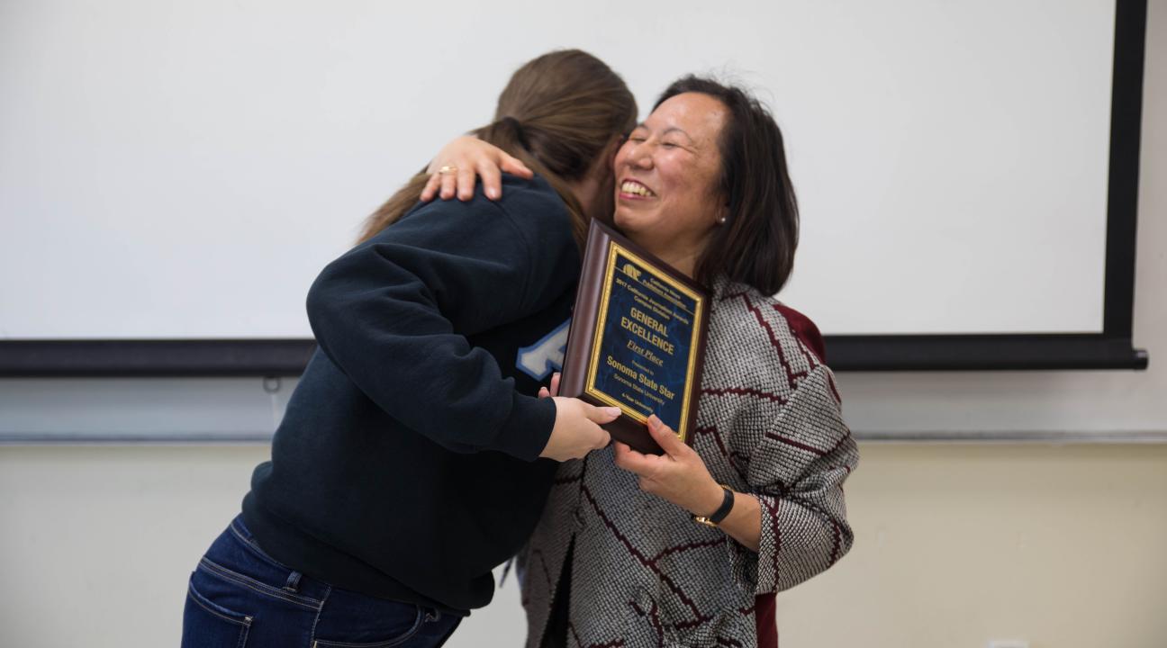President Sakaki presenting the award to Shannon Brown, the editor-in-chief of the STAR // Photo by Alyssa Archerda 