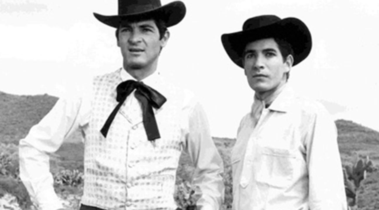 Still from Arturo Ripstein's film "Tiempo De Morir" (1966). Two men in vaquero attire