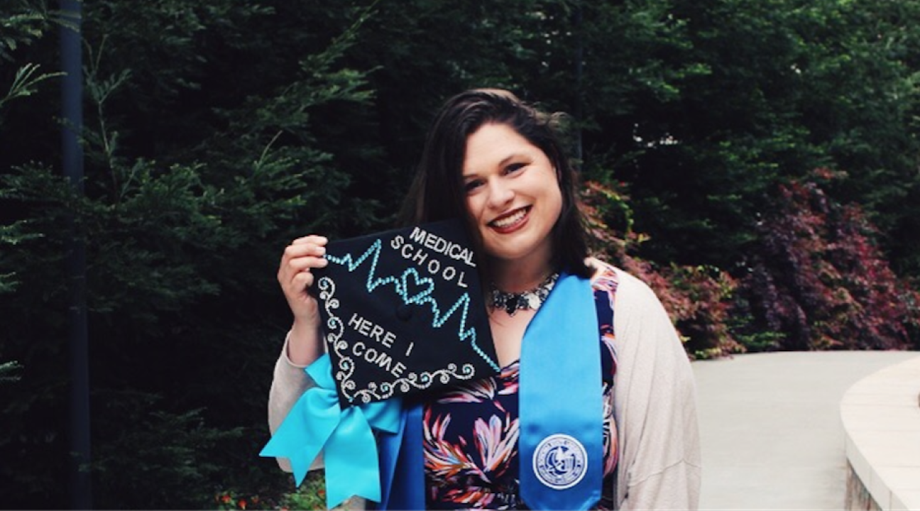 Emma Towslee showing off her graduation cap