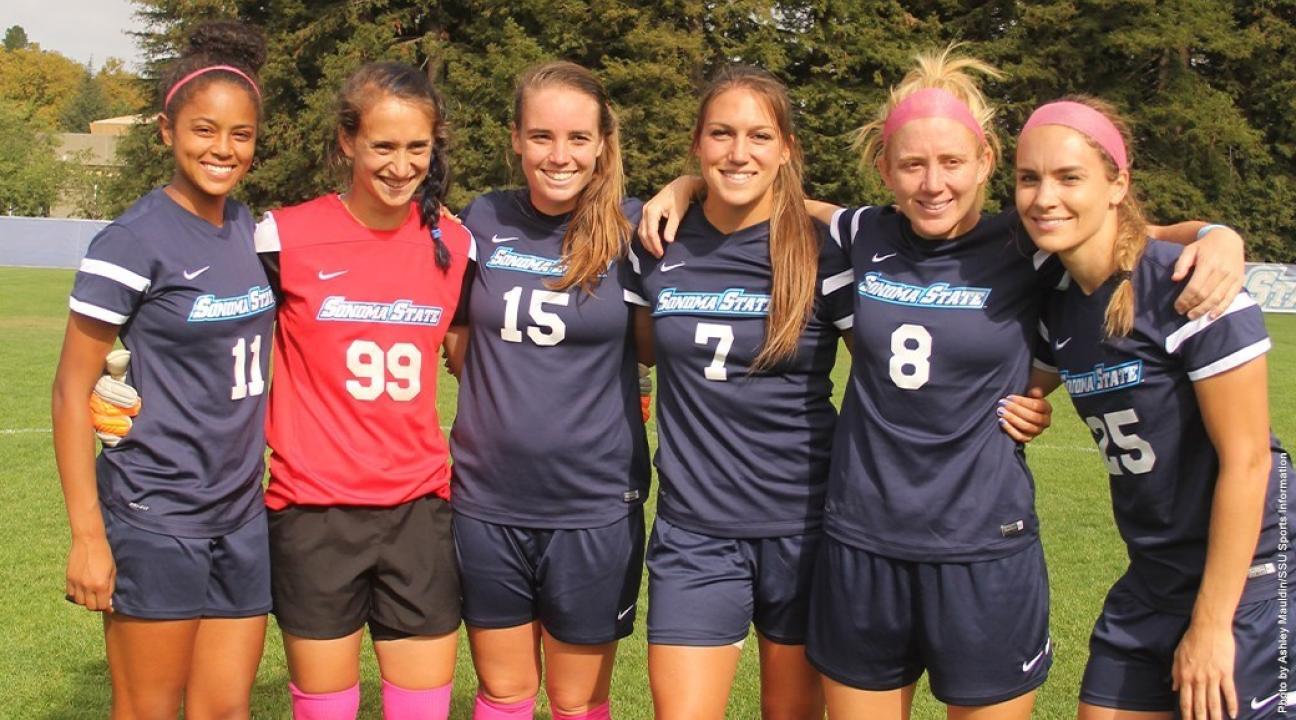 women's soccer team posing for photo