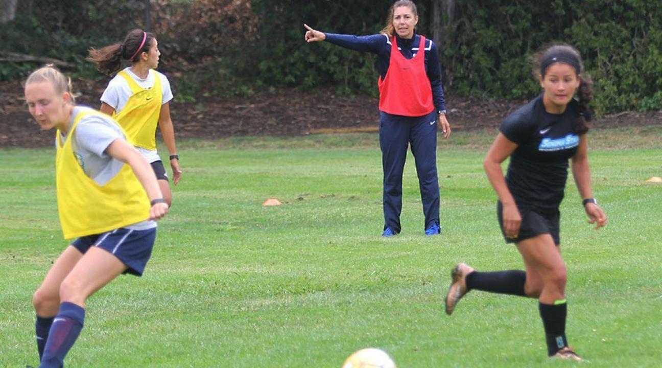 Seventh-year head coach Emiria Salzmann Dunn instructs players during Tuesday's training session.