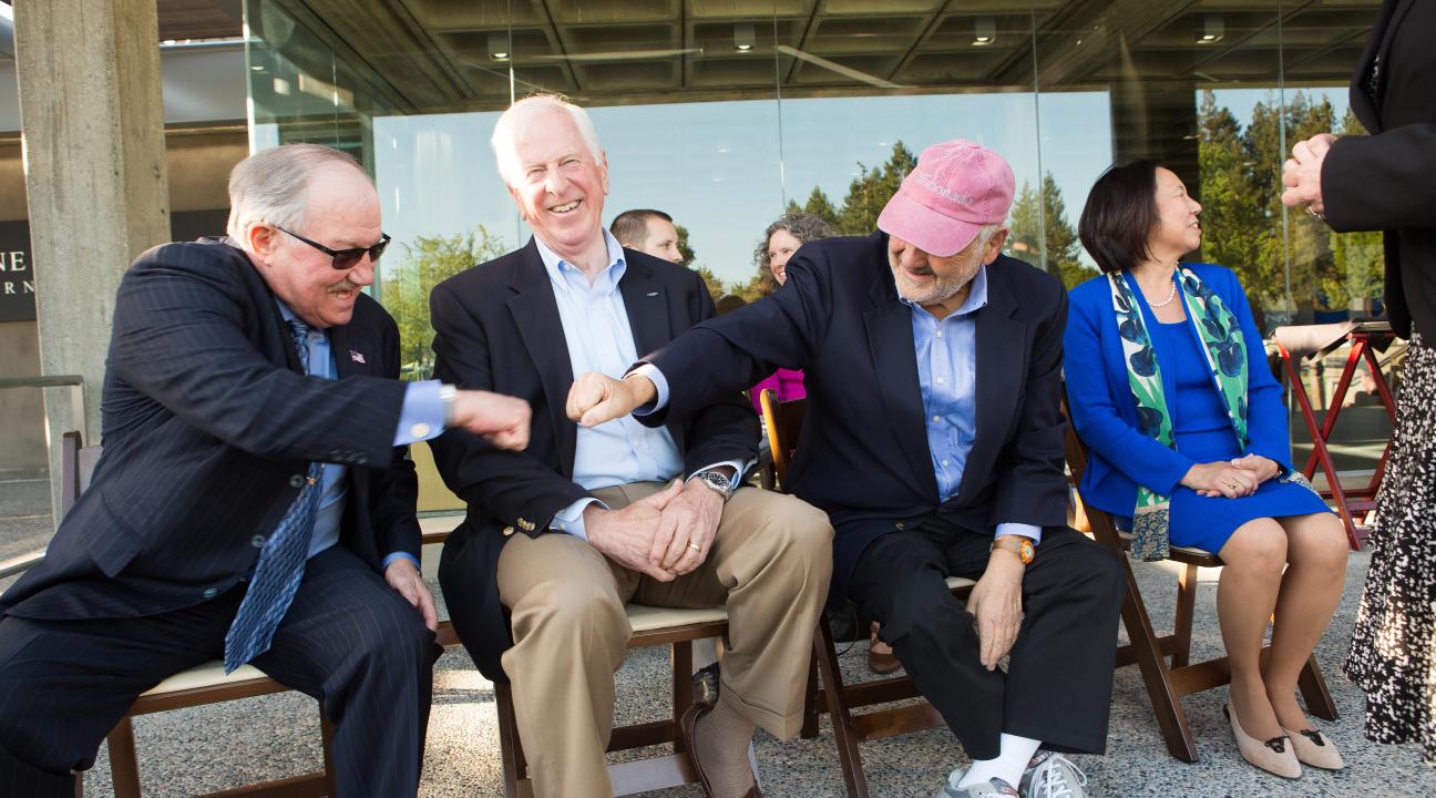 Gary Heck, president and owner of Korbel Champagne Cellars, and Wine Spectator editor and publisher Marvin R. Shanken, give each other a fist bump as Rep. Mike Thompson, D-St. Helena, looks on.